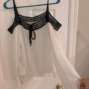 White top with black sequin piping
